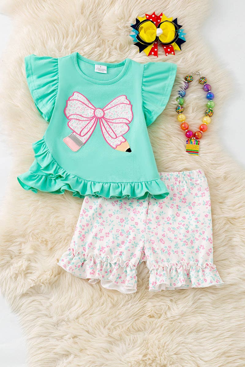 Pencil applique on mint top and floral shorts