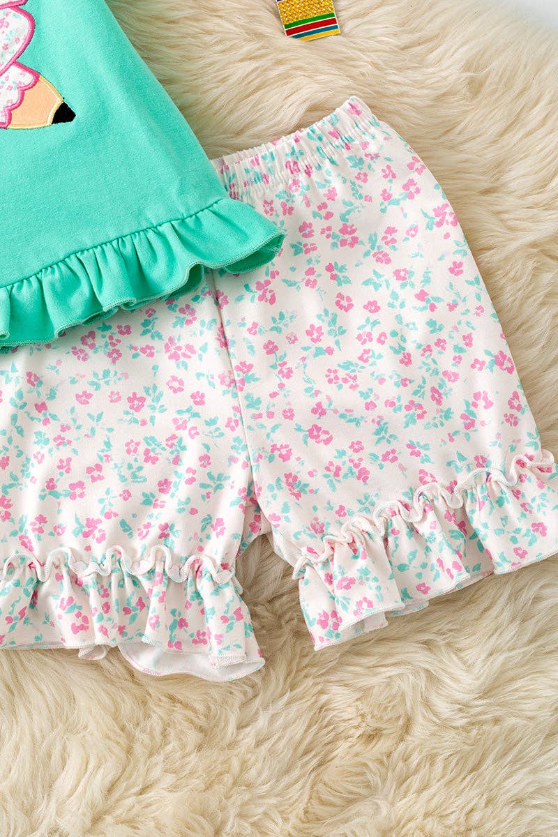 Pencil applique on mint top and floral shorts